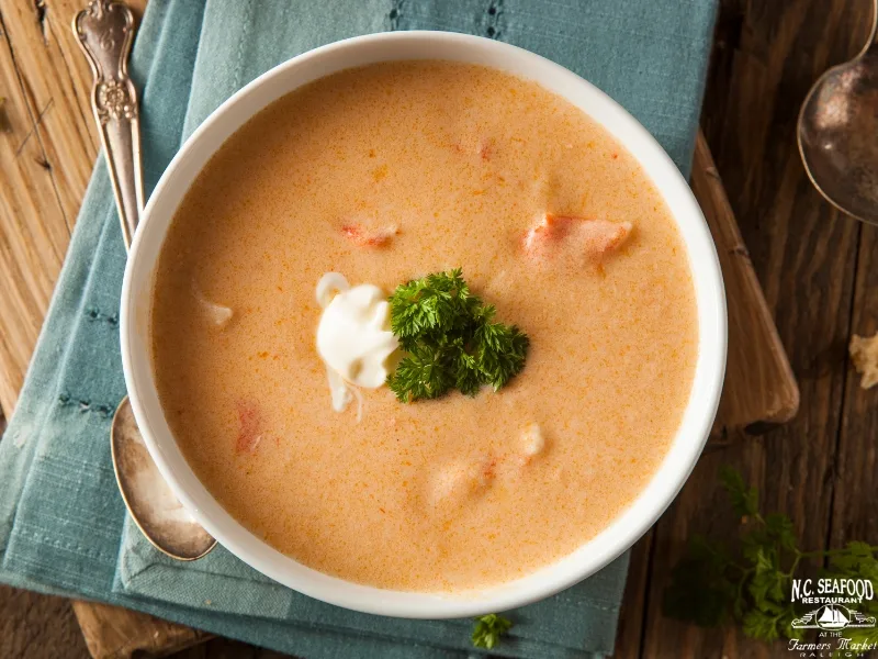 Lobster bisque with butternut squash is a twist to create delicious Thanksgiving seafood dishes 