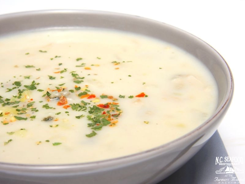 A bowl of seafood chowder for the blog titled "Dairy Free Seafood Chowder Recipe." 